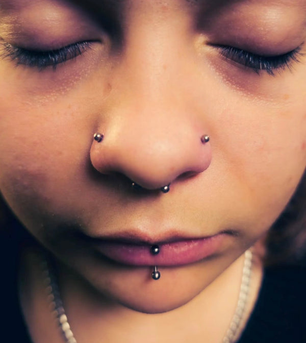 Double nostril piercing performed by Jay at Day Dweller Studios